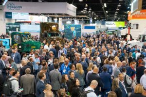 inside ACT exposition, crowds of people walking to different booths
